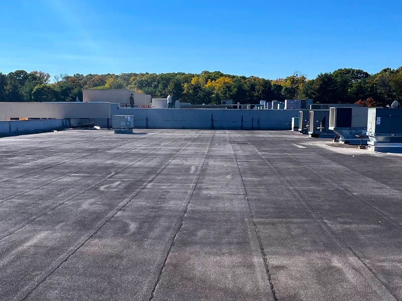 Deptford Shopping Center Deptford, NJ – AP-5100 Moisture Cure Polyurethane Asphalt Roof Before Photo from Roof Level Image of Deptford Shopping Center Deptford, NJ - AP-5100 Moisture Cure Polyurethane Asphalt Roof Before Photo from Roof Level
