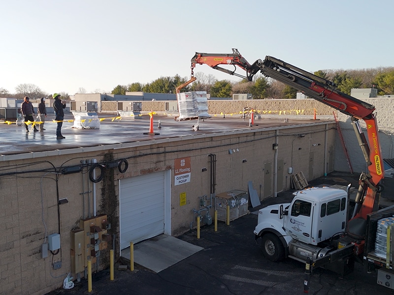 Deptford Shopping Center Deptford, NJ – Pallet of AP-5100 Moisture Cure Polyurethane Pails Boom Lifted onto Roof By Distributor Image of Deptford Shopping Center Deptford, NJ - Pallet of AP-5100 Moisture Cure Polyurethane Pails Boom Lifted onto Roof By Distributor